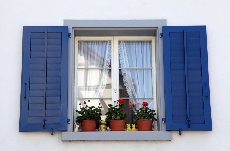 Shutters Repainted with Bright Colors